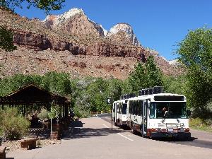 Shuttle bus stops at the Zion Canyon Visitor Center to load passengers