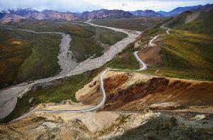 Aerial view of the Denali Park Road winding through the colorful Polychrome area.