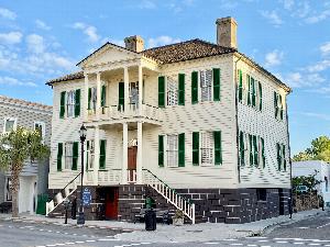 The John Mark Verdier House, Beaufort, South Carolina, an important example of the city's Federal style of architecture. The house is a two-story frame building with a hipped roof on an elevated stuccoed tabby basement.