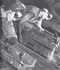 black and white photo of women welding 