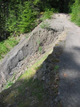 Photo of existing Boulder Creek Trail showing damaged section with serious erosion.