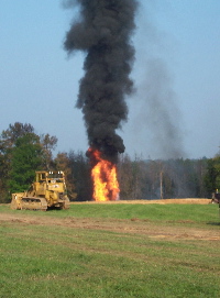 Photo of the wellhead fire during the blowout of the Howard/White Unit No. 1 Oil Well.  