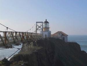 Looking out towards the ocean at the bridge leading to the lighthouse. 