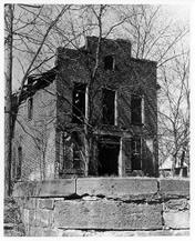 Black and White image of Jarboe store taken in 1963.   Building windows and doors are missing.