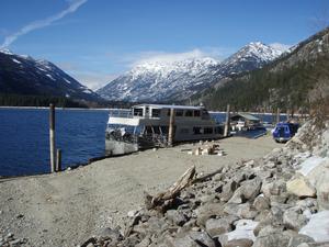 This photo shows the Lady Express, one of two public ferries serving Lake Chelan including the community of Stehekin.  The vessel is moored alongside the winter barge landing and public boat ramp.  The ferries dock in this area in winter during low lake levels.  These wintertime mooring conditions do not enable universal access for mobility-impaired persons.  