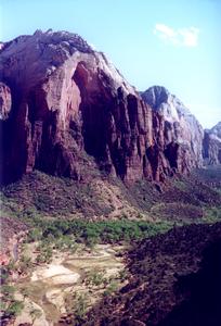 Photo of the Virgin River from Angel's Landing with high cliffs behind