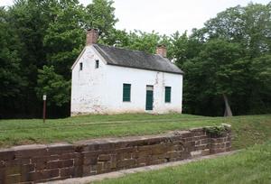 Image of Lockhouse 25 with canal lock in foreground.
