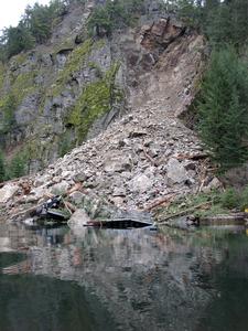 Photo taken shortly after the landslide.  This image shows a barge landing, dock and pickup truck that were destroyed by the slide.