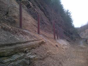 Photograph of high energy fence that was installed to prevent loose rock from injuring hikers and bikers entering and existing the Paw Paw Tunnel.