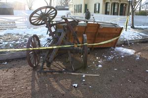Photo of damaged wagon partially showing label to be installed on temporary frame.