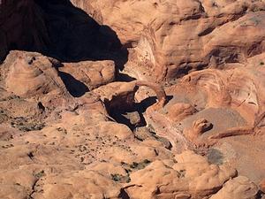 Aerial view of Rainbow Bridge and surrounding lands in Rainbow Bridge National Monument, Glen Canyon National Recreation Area, and the Navajo Nation.