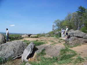 Photograph showing visitor impacts and soil erosion on the summit of Little Round Top. 