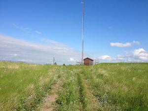 Existing Park Telecommunication Tower and small support Shed on Top of a Hill. The tower and Shed are Located North of the Abandoned Visitor Center and Just East of Hwy-85 in McKenzie County.