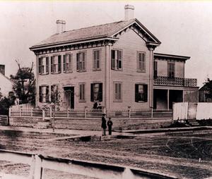 Photograph of Lincoln Home in 1860 showing historic fence and cap.
