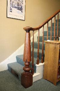 Photo of front staircase showing current carpet