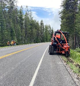 Typical trenching work for fiber optic cable installation along roadways.