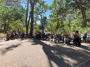 Electric and traditional bikes fill the bike racks at the ZION Grotto
